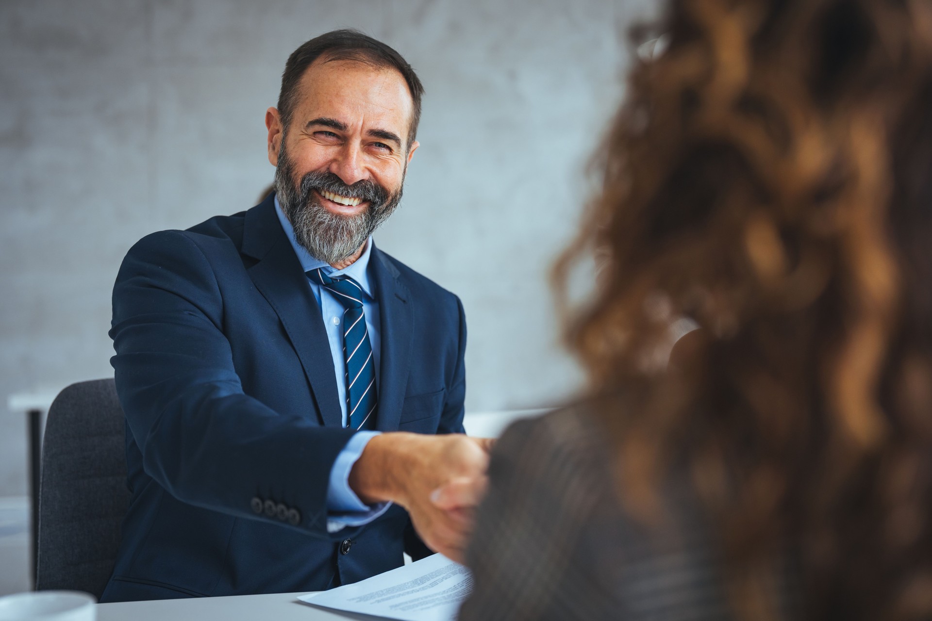 Businessman shake hands to businesswoman